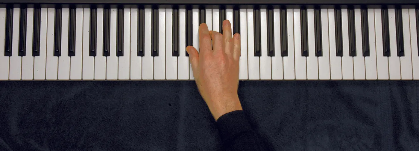 Abm chord played on a piano — hand position on the keys