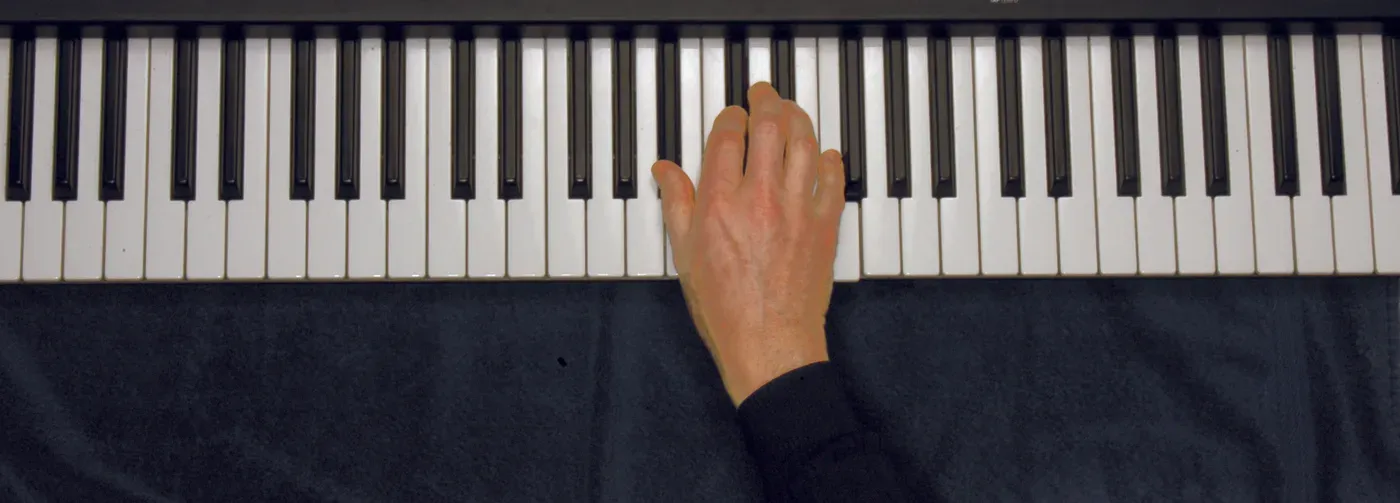 Bbm chord played on a piano — hand position on the keys