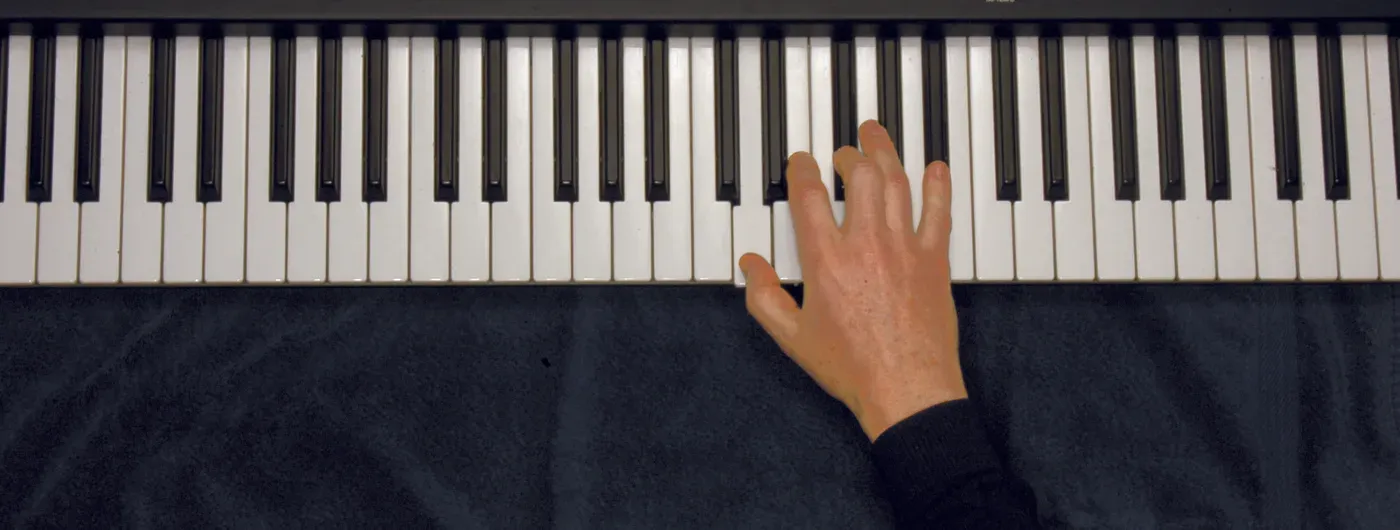 Daug chord played on a piano — hand position on the keys