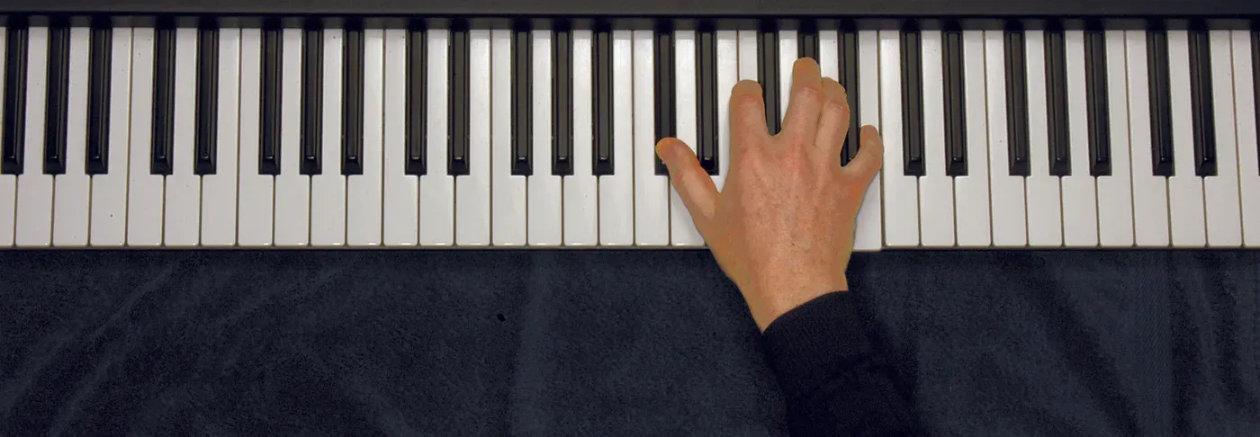 Db7 chord played on a piano — hand position on the keys
