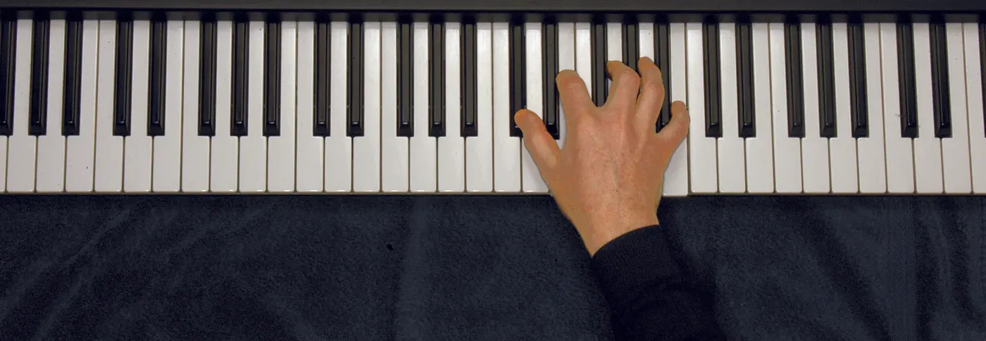 Dbm7b5 chord played on a piano — hand position on the keys