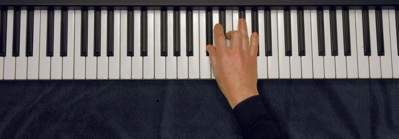 Dbm chord played on a piano — hand position on the keys
