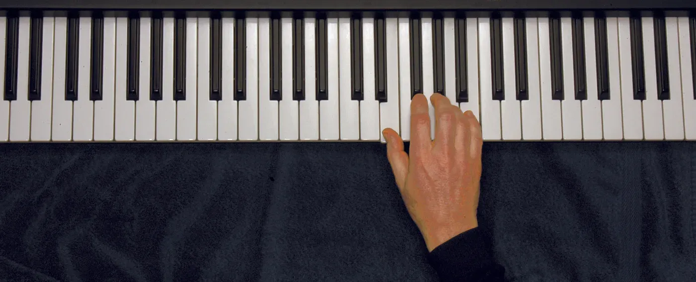 Esus4 chord played on a piano — hand position on the keys