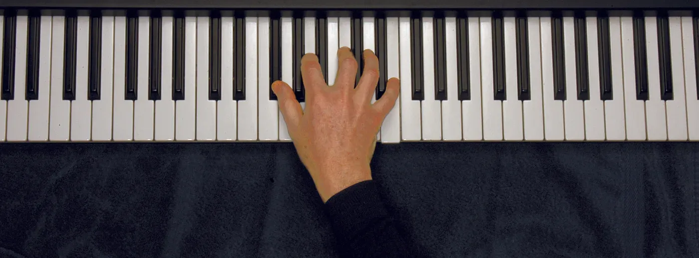 Gbm7b5 chord played on a piano — hand position on the keys